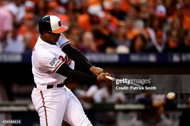 Jonathan Schoop hits a single in the second inning against Max Scherzer of the Detroit Tigers during Game One of the American League Division Series...