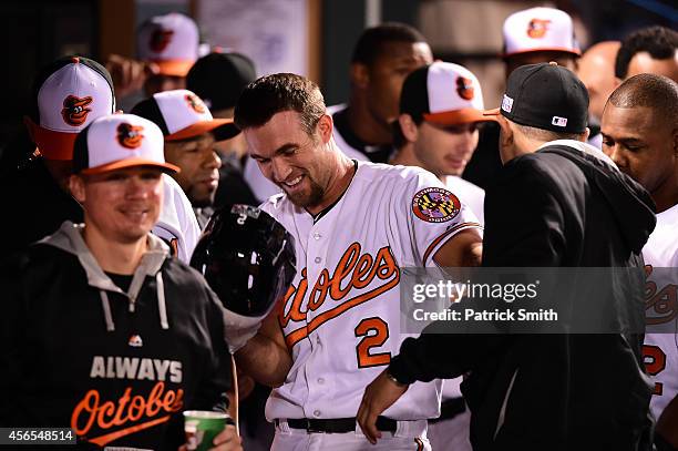 Hardy of the Baltimore Orioles celebrates with his teammates after hitting a solo home run in the seventh inning against Max Scherzer of the Detroit...