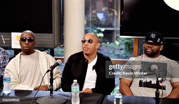 Rappers Inspectah Deck, U-God and Raekwon of the Wu-Tang Clan pose at a press conference to announce they have signed with Warner Bros. Records at...