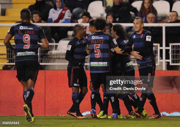 Diego Mainz Garcia, Hassan Yebda and Granada CF players celebrate after the opening goal is scored by team-mate Fran Rico during the La Liga match...