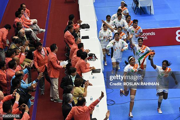 India's team celebrates after defeating Iran's team during their women's Kabaddi finals of the 17th Asian Games in Incheon on October 3, 2014 AFP...