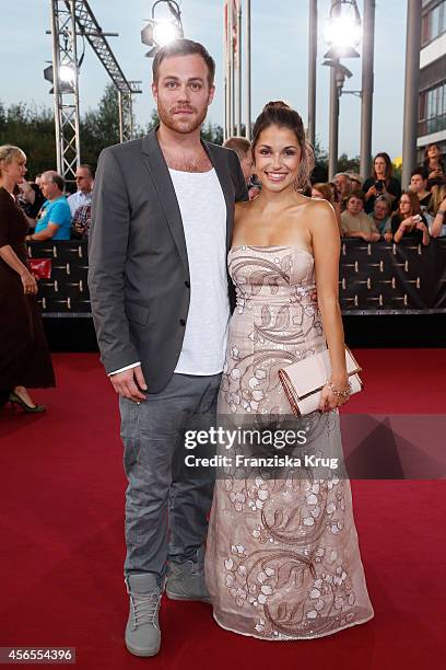 Bernhard Piesk and Anna Julia Kapfelsperger attend the red carpet of the Deutscher Fernsehpreis 2014 on October 02, 2014 in Cologne, Germany.