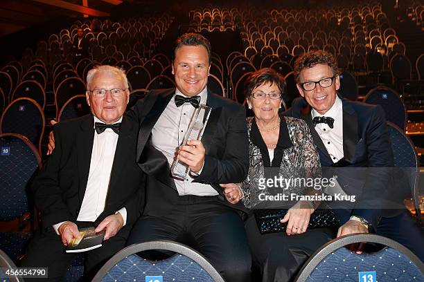 Erich Kretschmer, Guido Maria Kretschmer, Marianne Kretschmer and Frank Mutters, attends the Deutscher Fernsehpreis 2014 after show party on October...
