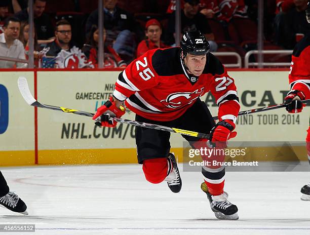 Cam Janssen of the New Jersey Devils skates against the New York Islanders at the Prudential Center on October 2, 2014 in Newark, New Jersey. The...