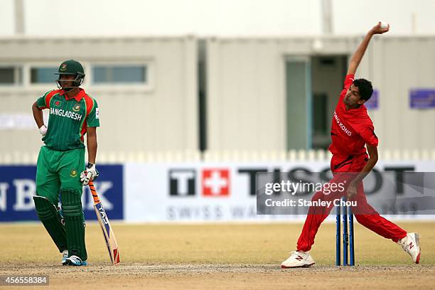 Adil Mehmood of Hong Kong bowls during the Mens Cricket Bronze Medal match between Bangladesh and Hong Kong during day fourteen of the 2014 Asian...