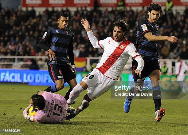 Goalkeeper Roberto Fernandez of Granada CF saves the ball from Joaquin Larrivey of Rayo Vallecano de Madrid during the La Liga match between Rayo...