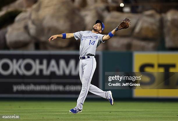 Omar Infante of the Kansas City Royals makes a catch in the eighth inning against the Los Angeles Angels during Game One of the American League...