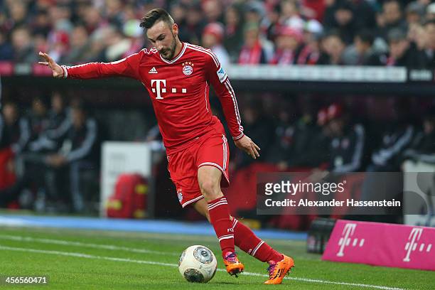 Diego Contento of Muenchen runs with the ball during the Bundesliga match between FC Bayern Muenchen and Hamburger SV at Allianz Arena on September...