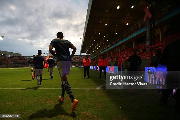 Players of Chivas get into the field prior a match between Toluca and Chivas as part of 11th round Apertura 2014 Liga MX at Nemesio Diez Stadium on...