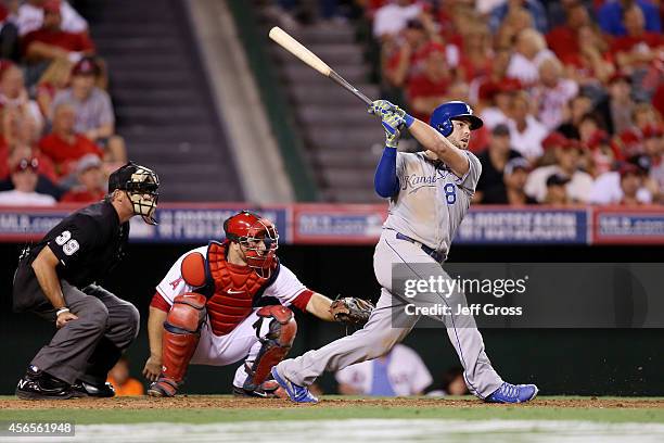 Mike Moustakas of the Kansas City Royals watches his solo home run in the eleventh inning to take a 3-2 lead against the Los Angeles Angels during...