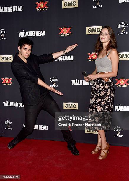 Nick Simmons and guest attend the season 5 premiere of "The Walking Dead" at AMC Universal City Walk on October 2, 2014 in Universal City, California.