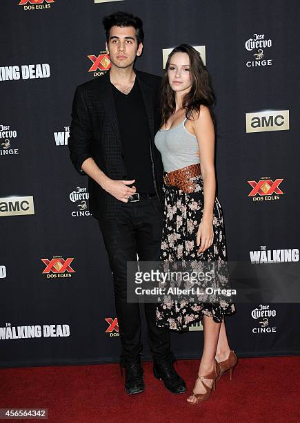 Nick Simmons and actress Alex Essoe arrive for the Season 5 Premiere Of "The Walking Dead" held at AMC Universal City Walk on October 2, 2014 in...