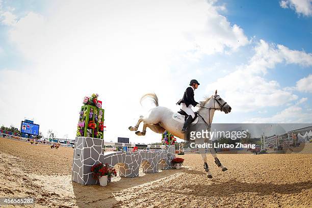 Zhang Linbin of China rides Karsen competes in Modern Pentathlon Men's Individual Riding in day fourteen of the 2014 Asian Games at Dream Park...