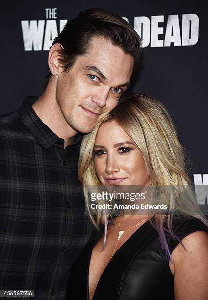 Actress Ashley Tisdale and her husband, musician Christopher French arrive at the Season 5 premiere of AMC's "The Walking Dead" at AMC Universal City...