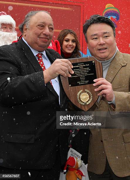 John Catsimatidis and David W. Chien attend CitySightseeing New York 2013 holiday toy drive at PAL's Harlem Center on December 14, 2013 in New York...