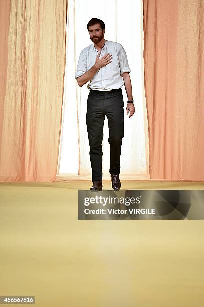 Designer Christophe Lemaire walks the runway during the Hermes Ready to Wear show as part of the Paris Fashion Week Womenswear Spring/Summer 2015 on...