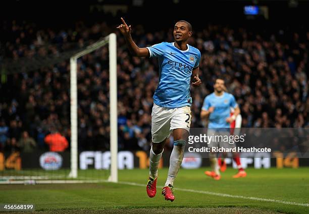 Fernandinho of Manchester City celebrates scoring their fifth goal past Wojciech Szczesny of Arsenal during the Barclays Premier League match between...