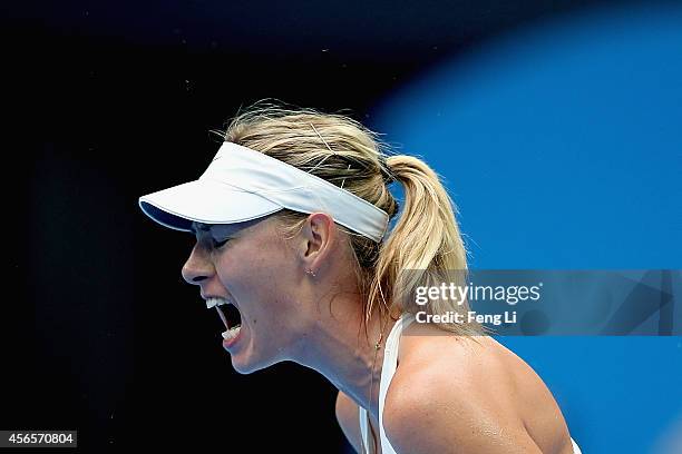 Maria Sharapova of Russia celebrates winning against Svetlana Kuznetsova of Russia during day seven of the China Open at the National Tennis Center...