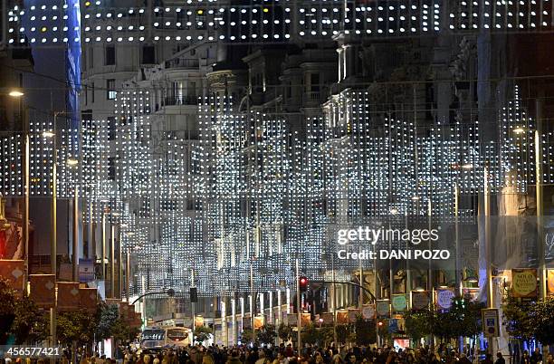 Supporters of anticapitalist social movement Rodea El Congreso make their way under christmas lights to a protest dubbed "Surround the congress" in...