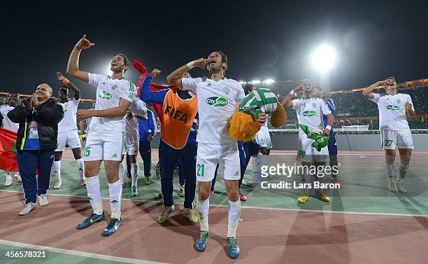 Adil Karrouchy of Casablanca celebrates with team mates after winning the FIFA Club World Cup Quarterfinal match between Raja Casablanca and CF...
