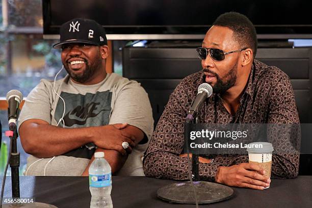 Rappers Raekwon and RZA of the Wu-Tang Clan attend a press conference to announce that the Wu-Tang Clan has signed with Warner Bros. Records at...