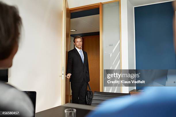 busisenessman walking in to job interview - office doorway stock pictures, royalty-free photos & images