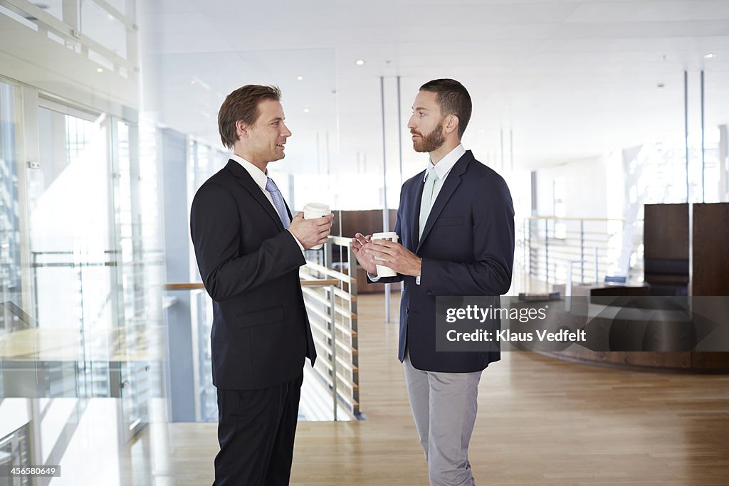 Business people having casual meeting with coffee