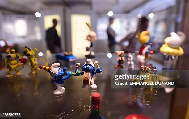 Figurines of characters from the Belgian comic series "The Smurfs" created by Belgian cartoonist Peyo , are displayed in the "Centre Belge de la...