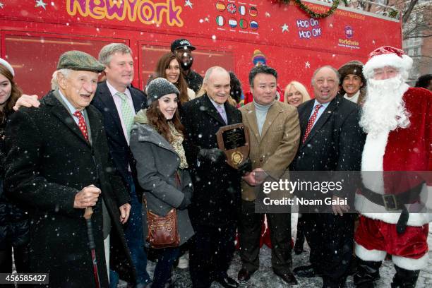 Robert M. Morgenthau, John Osborn, Juliette Goglia, Ray Kelly, David W. Chien, John Catsimatidis and Santa Claus attend the 2013 CitySightseeing New...