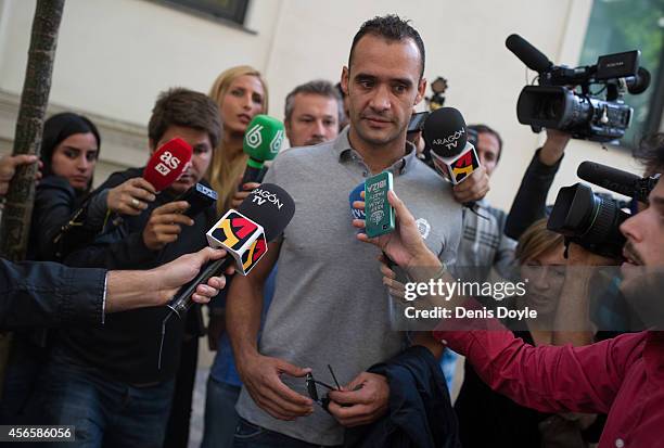 Juanfran Garcia of Levante UD is surrounded by journalists outside the Spanish Anti-Corruption headquarters on October 3, 2014 in Madrid, Spain....