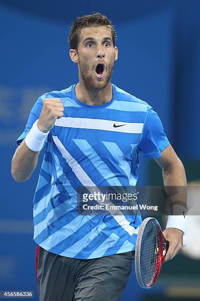 Martin Klizan of Slovakia celebrates winning a point against Rafael Nadal of Spain during day seven of the China Open at the China National Tennis...