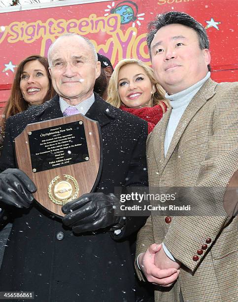 Police Commissioner Raymond Kelly and David W. Chien attend CitySightseeing New York 2013 holiday toy drive>> at PAL's Harlem Center on December 14,...