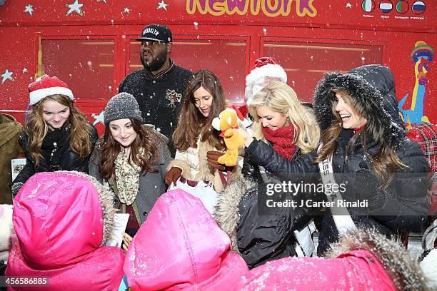 Kerris Dorsey, Juliette Goglia, Griz Chapman, Carol Alt, Cassidy Wolf, and Erin Brady attend City Sightseeing New York 2013 holiday toy drive at...