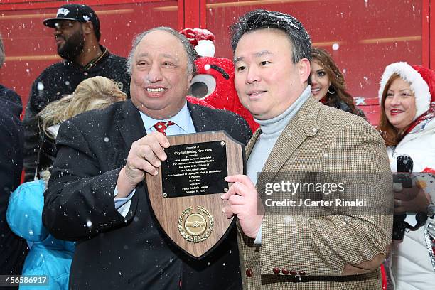 John Catsimatidis and David W. Chien attends CitySightseeing New York 2013 holiday toy drive at PAL's Harlem Center on December 14, 2013 in New York...