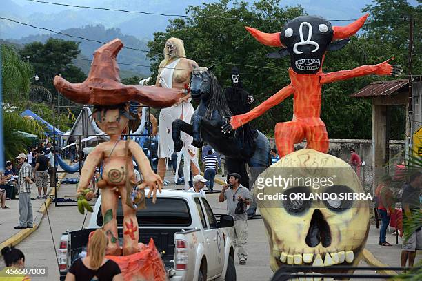 Giant dolls are seen during the "Paseo Real de las Chimeneas Gigantes" parade, in Trinidad municipality, Santa Barbara department, 220 km west of...