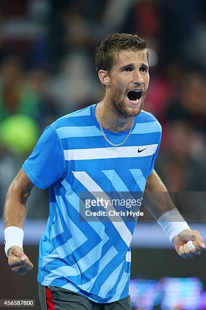 Martin Klizan of Slovakia celebrates winning his match against Rafael Nadal of Spain during during day seven of the China Open at the National Tennis...