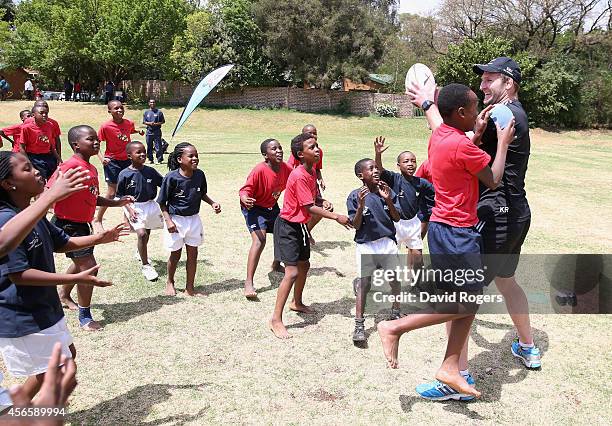 Kieran Read of the New Zealand All Blacks holds onto the ball during a coaching clinic as part of the All Blacks visit to Qeen's High School as part...