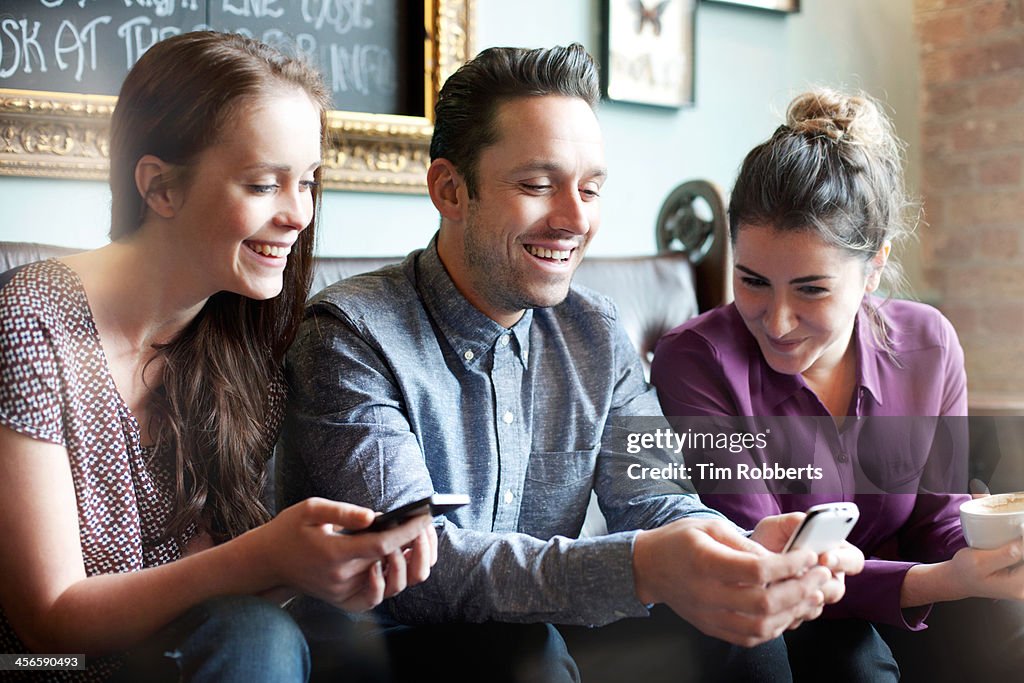Friends looking at smartphone
