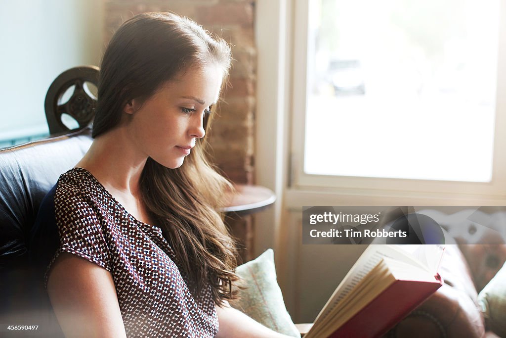 Young woman reading book.