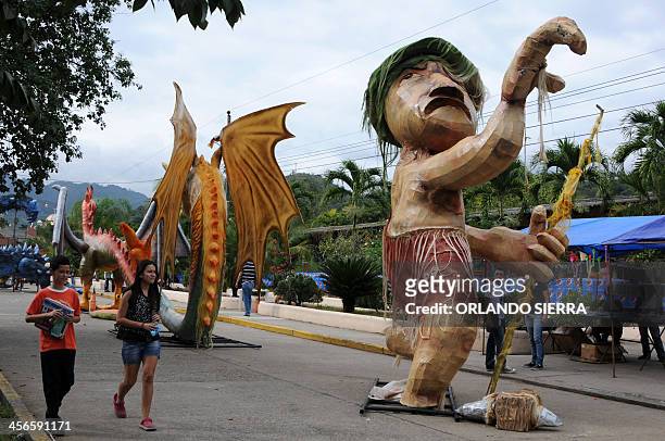 Giant dolls are seen during the "Paseo Real de las Chimeneas Gigantes" parade, in Trinidad municipality, Santa Barbara department, 220 km west of...