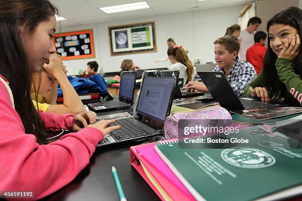 Students studying Earth Science at the Hopkinton Middle School on their Chromebooks.
