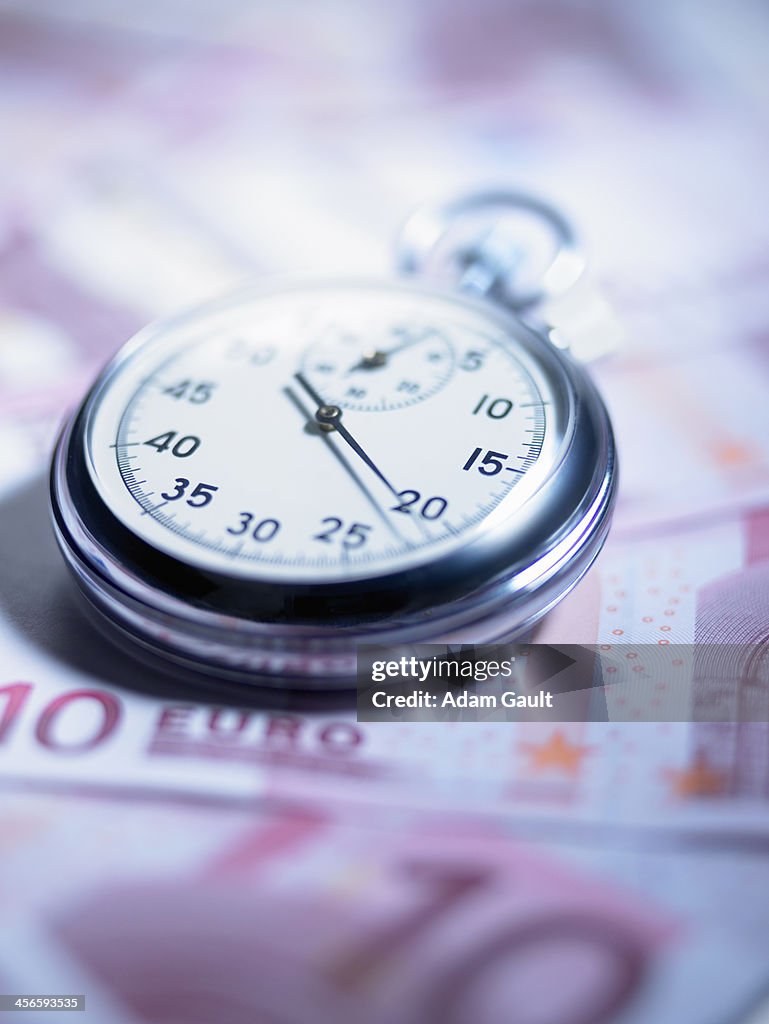 Stopwatch with euro banknotes