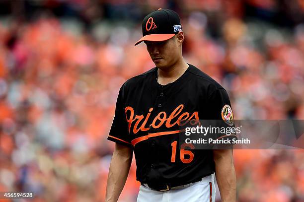 Wei-Yin Chen of the Baltimore Orioles walks to the dugout after being relieved in the fourth inning against the Detroit Tigers during Game Two of the...