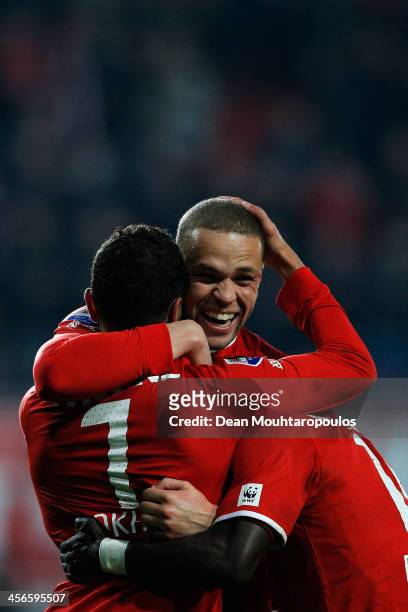 Luc Castaignos of Twente celebrates scoring the second goal of the game with team mate Youness Mokhtar during the Eredivisie match between FC Twente...