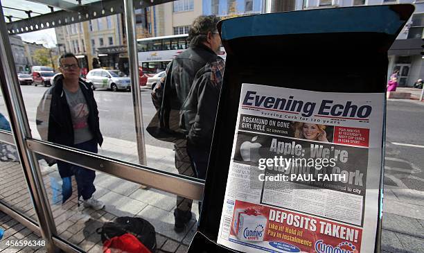 Apple in the headlines in The Evening newspaper, seen on sale in Cork city centre in Cork, southern Ireland on October 2, 2014. Perched on top of a...