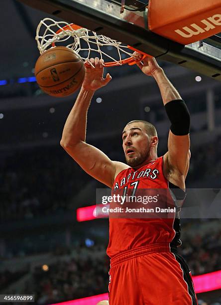 Jonas Valanciunas of the Toronto Raptors dunks against the Chicago Bulls at the United Center on December 14, 2013 in Chicago, Illinois. NOTE TO...