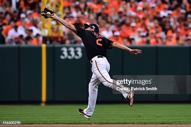 Hardy of the Baltimore Orioles catches a ball hit Ezequiel Carrera of the Detroit Tigers in the seventh inning during Game Two of the American League...