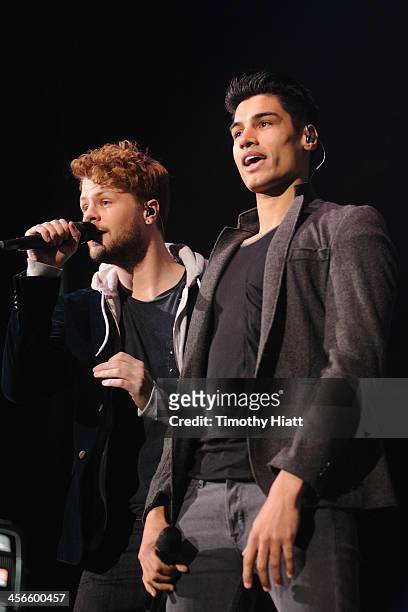 Jay McGuiness and Siva Kaneswaran of The Wanted performs during the B96 Pepsi Jingle Bash at Allstate Arena on December 14, 2013 in Chicago, Illinois.