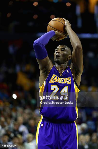 Kobe Bryant of the Los Angeles Lakers shoots a free throw late in the fourth quarter against the Charlotte Bobcats to give his team the lead at Time...