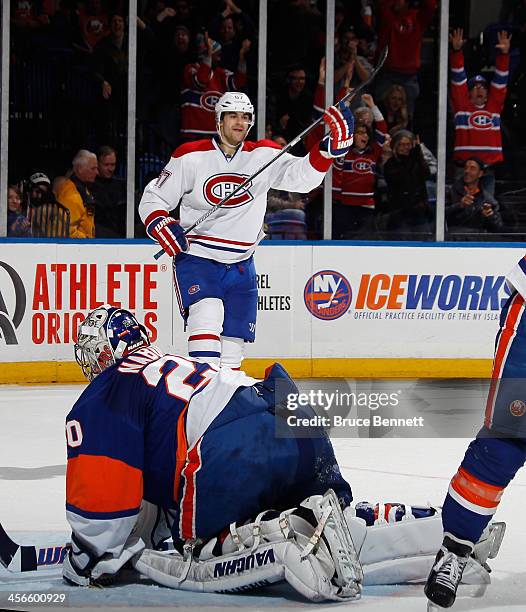 Max Pacioretty of the Montreal Canadiens celebrates his game winning goal at 1:51 of overtime against Evgeni Nabokov of the New York Islanders at the...